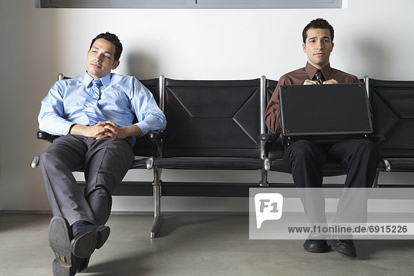 Businessmen in Waiting Area