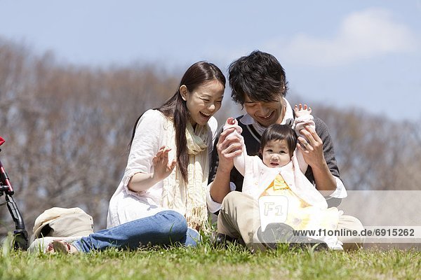 Parents with Baby Girl in Park