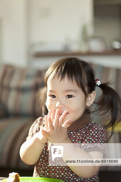 Young Girl with Hands Clasped