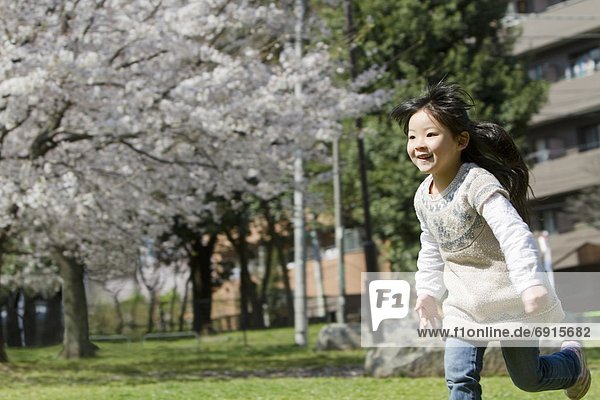 Japanese Girl Running in Park