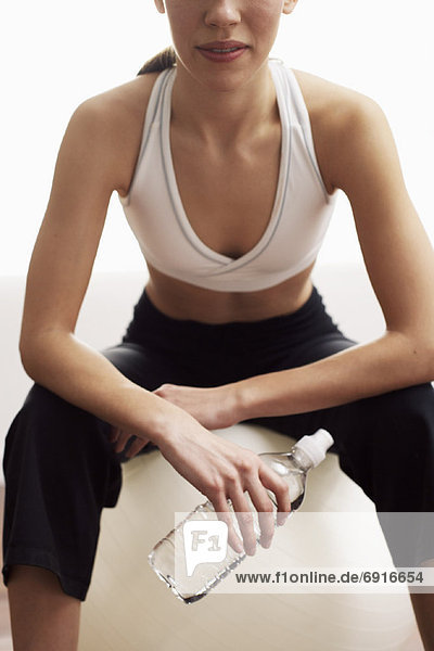 Woman Sitting on Exercise Ball