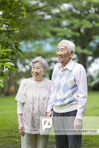 Senior couple holding hands  Tokyo Prefecture  Honshu  Japan