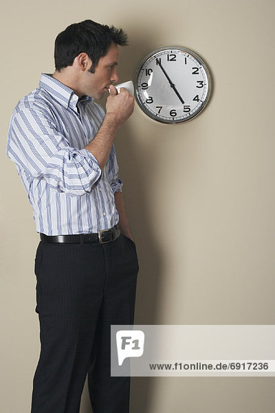 Businessman Looking at Clock