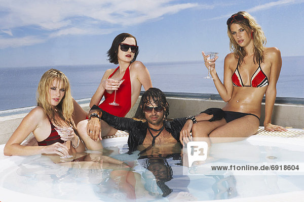 Man in Hot Tub with Three Women