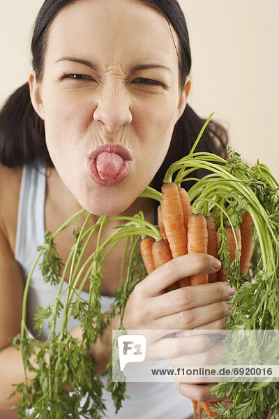 Woman Holding Carrots