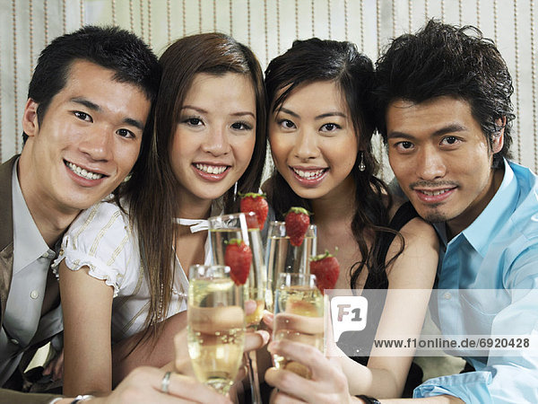 Portrait of Group with Champagne And Strawberries