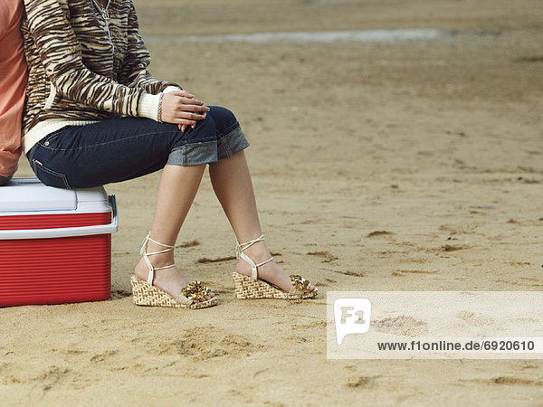 Woman Sitting on Cooler
