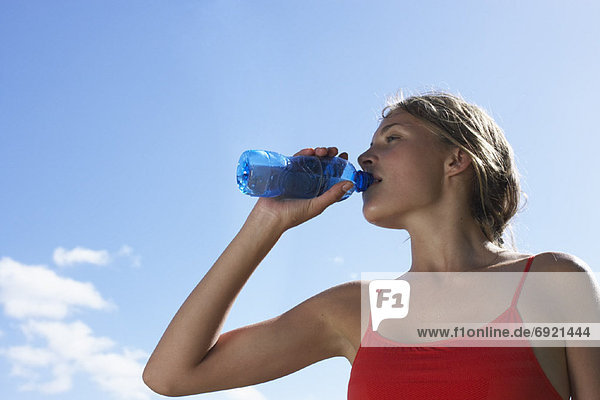 Woman Drinking Water Outdoors