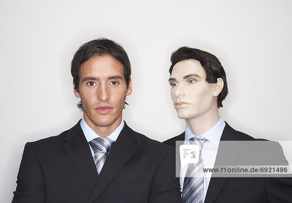 Portrait of Businessman With Mannequin