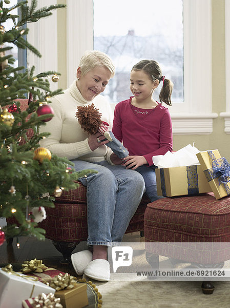 Girl Opening Presents with Grandmother