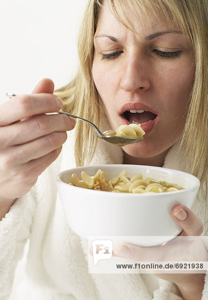 Woman Eating Chicken Noodle Soup