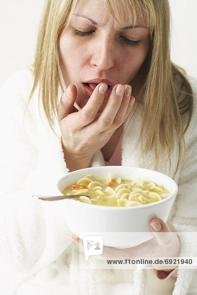 Woman Eating Chicken Noodle Soup