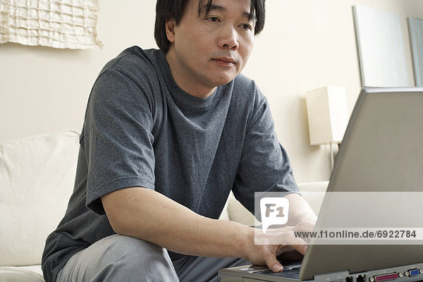 Man Working on Laptop Computer
