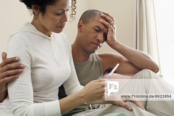 Couple Looking at Pregnancy Test