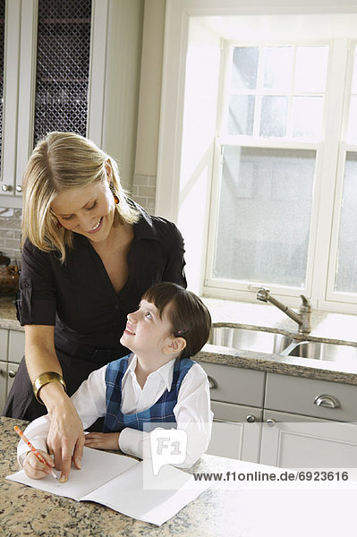 Mother Helping Daughter with Homework