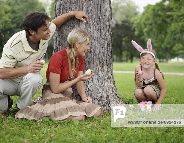 Family in Park  Easter Egg Hunt