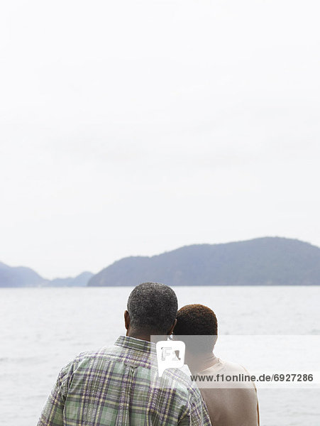 Couple Looking over Water