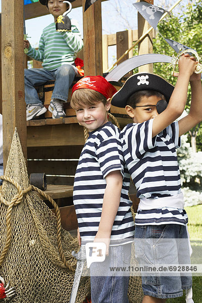 Portrait of Boys Pretending to be Pirates