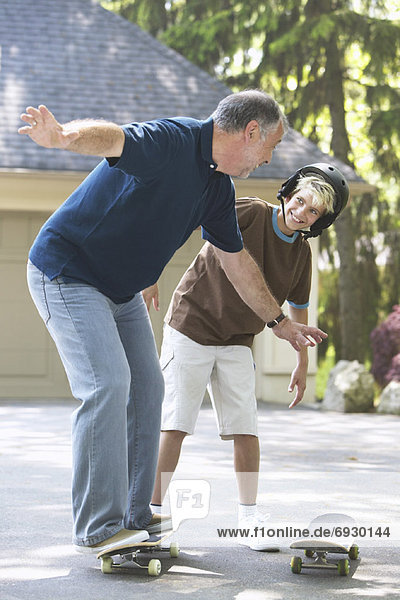 Grandfather and Grandson with Skateboard
