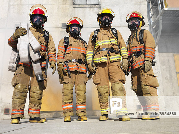 Firefighters Outside of Smoke-filled Building
