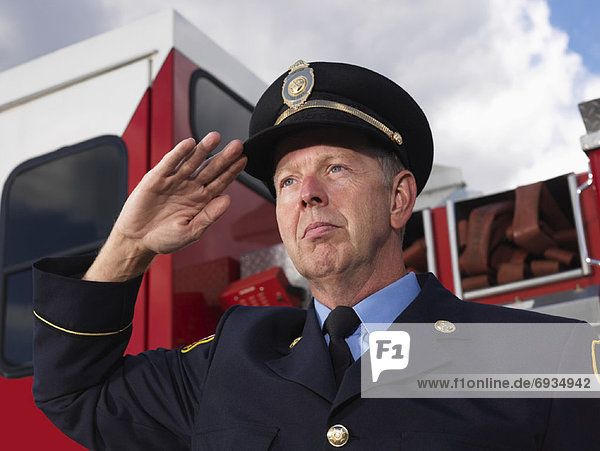 Fire Chief Saluting by Fire Truck