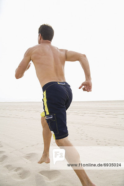 Man Running on Beach