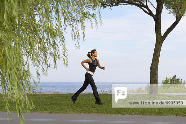 Woman Running in Park