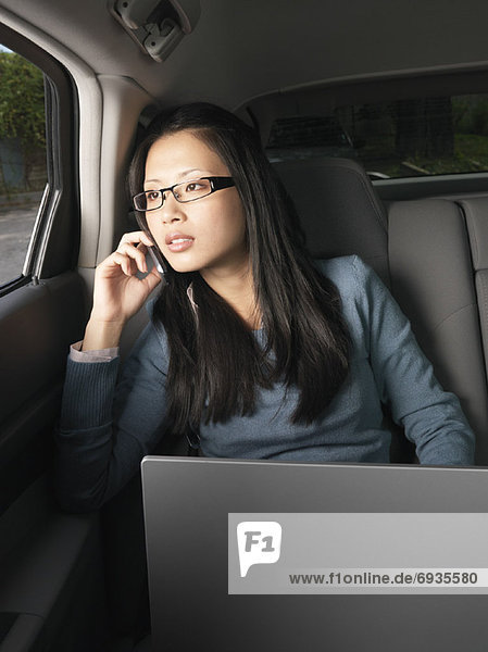 Businesswoman Working in Car