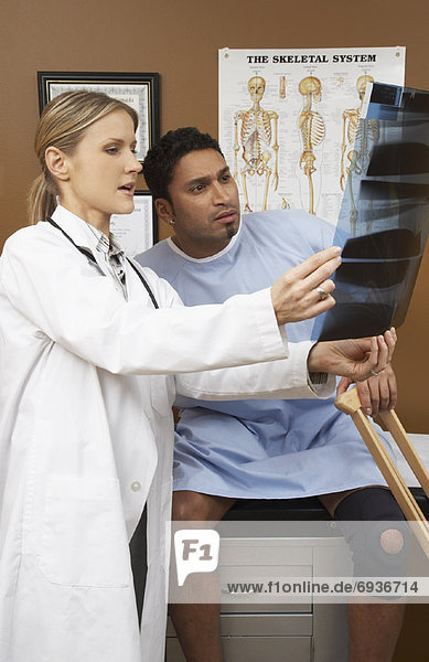 Doctor Showing Patient X-Ray