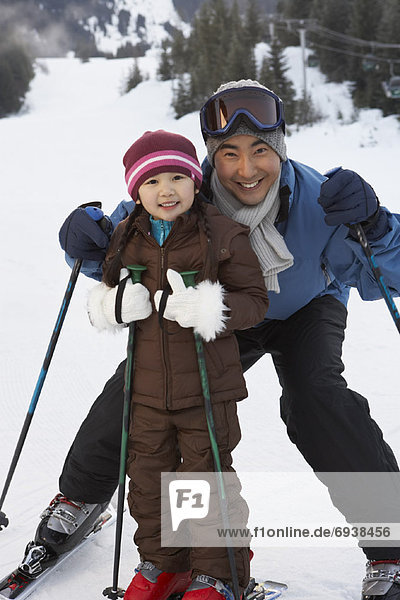 Father and Daughter on Ski Hill  Whistler  British Columbia  Canada