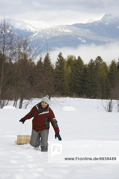 Man Pulling Toboggan  Whistler  British Columbia  Canada