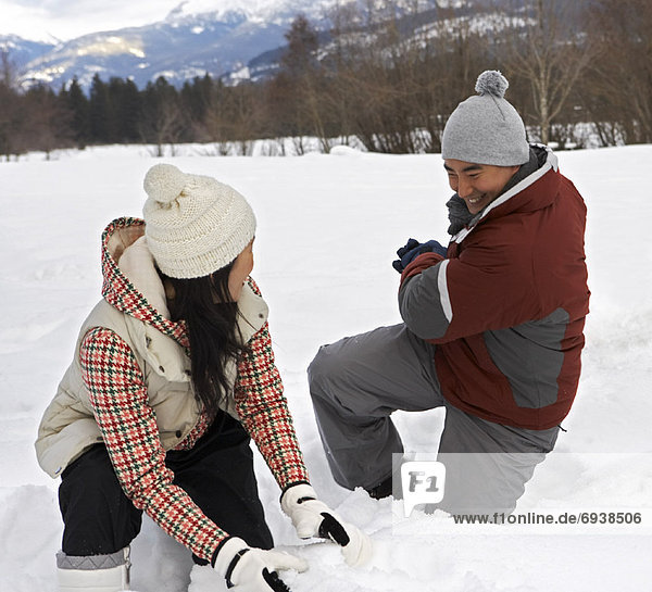 Couple Playing in Snow  Whistler  British Columbia  Canada
