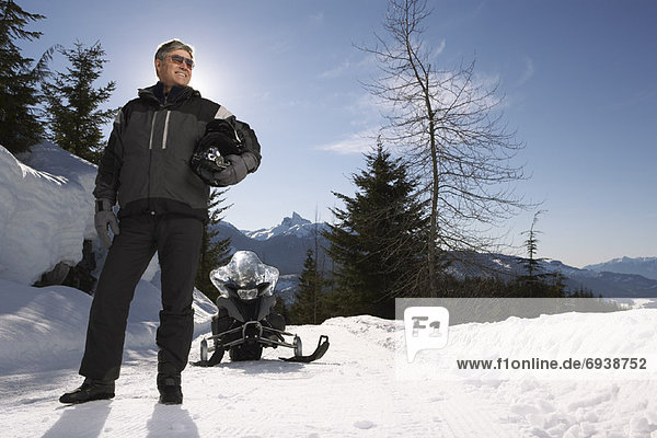 Portrait of Man with Snowmobile