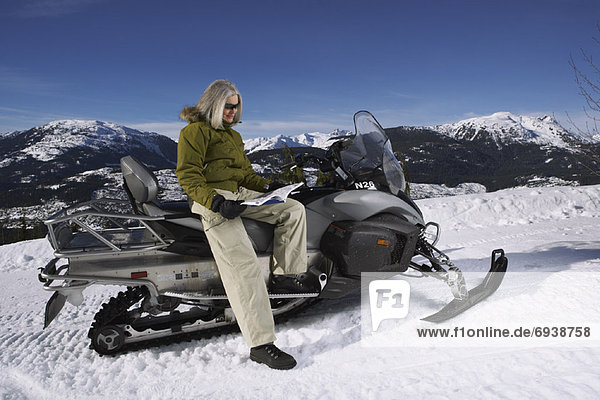 Woman with Snowmobile