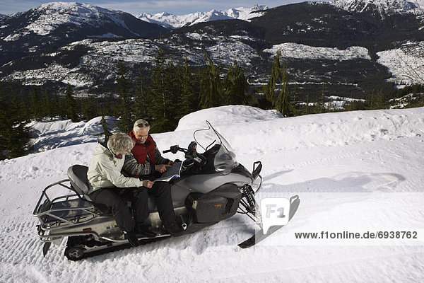 Couple with Snowmobile