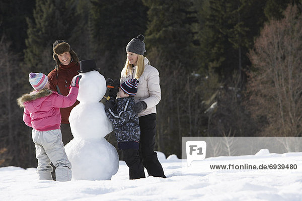 Family Making Snowman
