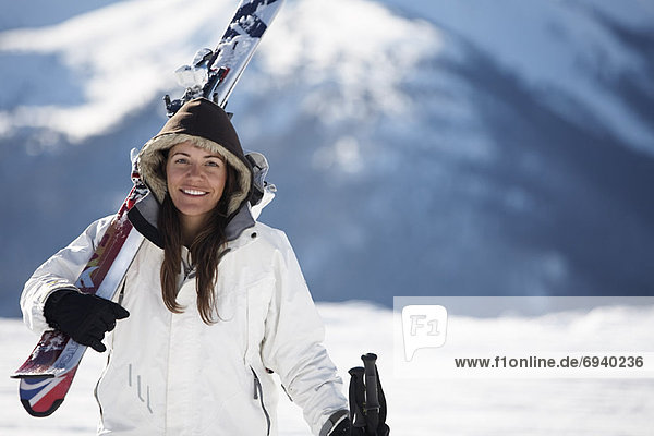 Woman Carrying Skis  Whistler  British Columbia  Canada
