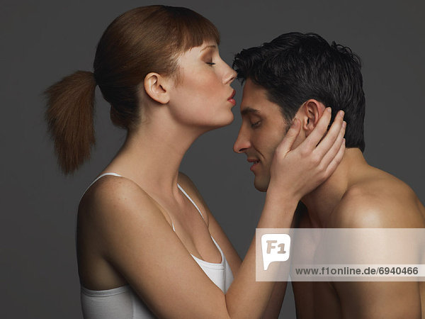 Woman Kissing Mans Forehead