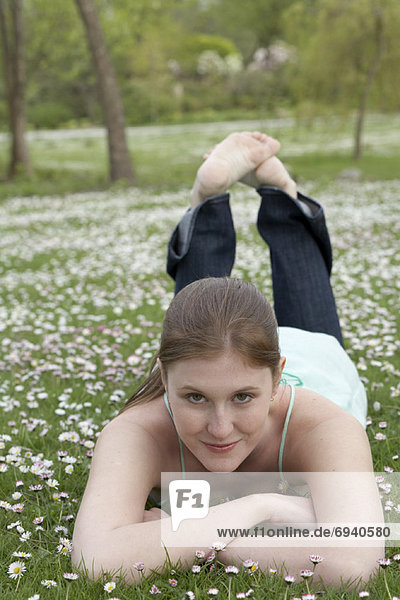 Woman Lying Down on Grass