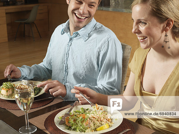 Couple Sitting at Dinner Table