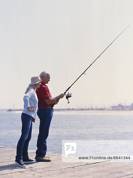 Couple Fishing on Wharf