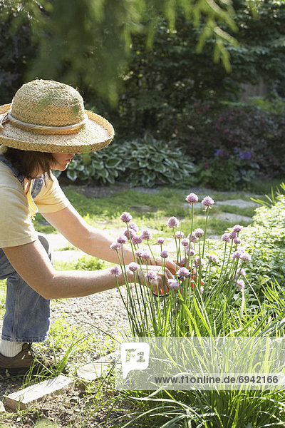 Woman Gardening in Backyard