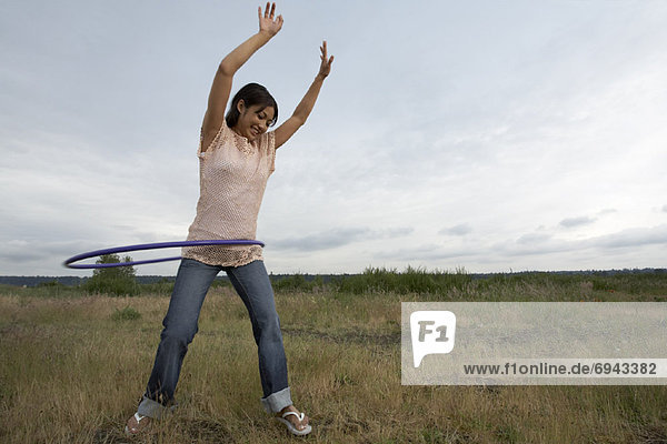Woman Playing with Hula-Hoop