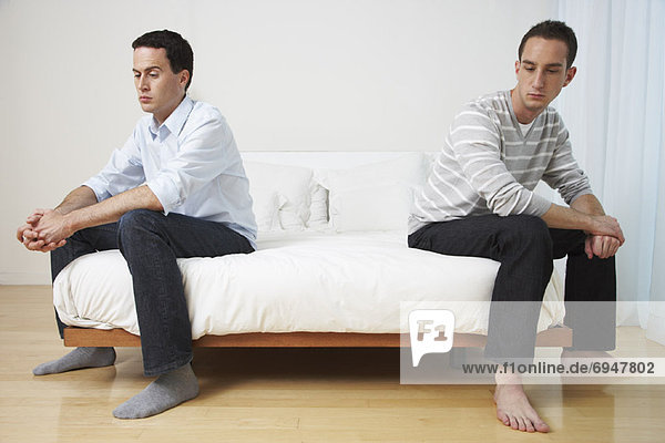 Couple Sitting on Bed