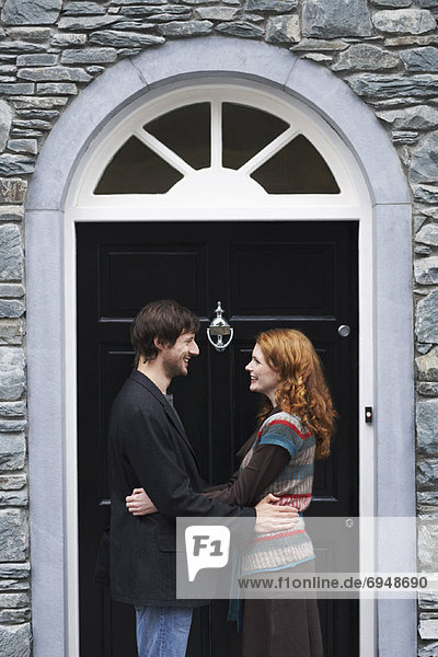 Couple on House Doorstep