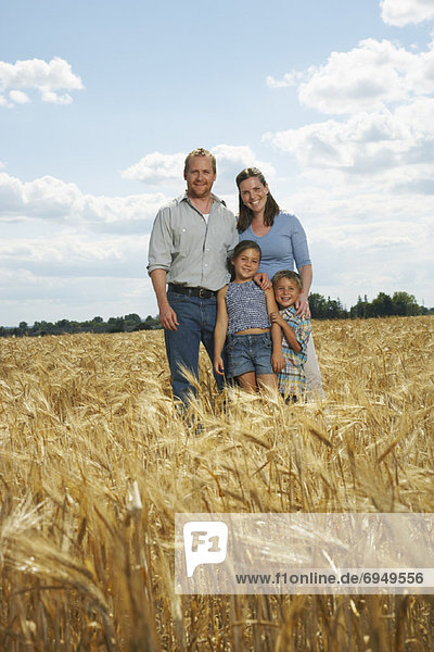 Portrait of Family in Wheat Field