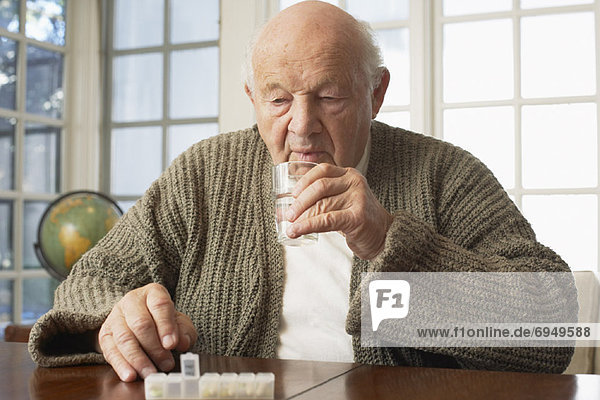 Senior Man Taking Pills