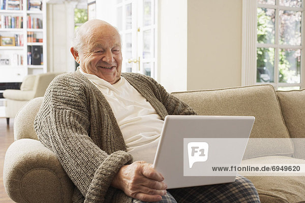 Senior Man Using Laptop Computer