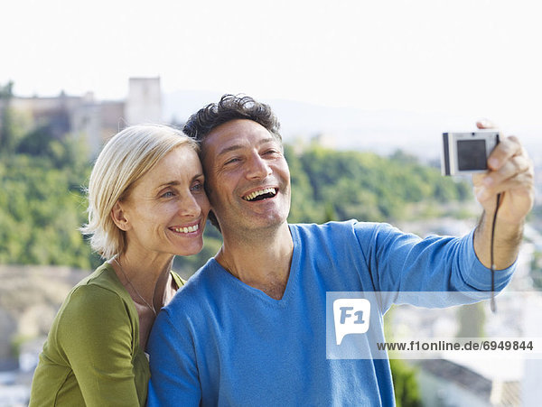 Couple Taking Photo of Themselves