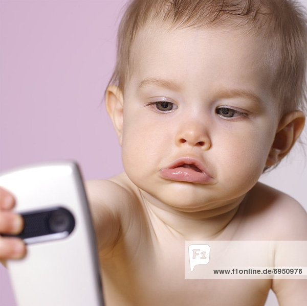 Baby Holding Cell Phone